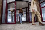 Two people are leaving the university library